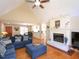 Comfortable living room with a fireplace and hardwood floors at 703 E Stanley St, Four Oaks, NC 27524