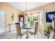 Charming dining area with bay window and glass-top table at 7329 Blannie Farms, Willow Springs, NC 27592