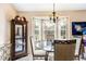 Bright dining area with modern light fixture and large windows at 7329 Blannie Farms, Willow Springs, NC 27592