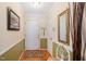 Bright foyer with hardwood floors and elegant decorative mirror at 7329 Blannie Farms, Willow Springs, NC 27592