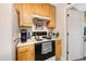 Cozy kitchen with white countertops and wooden cabinets at 7329 Blannie Farms, Willow Springs, NC 27592