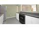 Functional kitchen area with an electric cooktop, white cabinets, and a refrigerator at 7409 Birch Tree Ln, Wake Forest, NC 27587