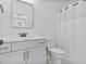 Clean bathroom with white vanity, framed mirror, and a shower/tub combo at 8487 Old Us 421, Lillington, NC 27546