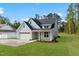 This single Gathering home boasts a large yard, two car garage, and welcoming porch at 8487 Old Us 421, Lillington, NC 27546