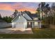 Charming craftsman-style home with a two-car garage, pretty yard, and welcoming front porch at 8487 Old Us 421, Lillington, NC 27546
