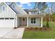 Beautiful home featuring a charming front porch and landscaped yard at 8487 Old Us 421, Lillington, NC 27546