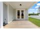 Covered front porch with double doors and modern lighting fixture at 8487 Old Us 421, Lillington, NC 27546