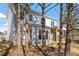 This home has a lovely back exterior with screened in patio and lovely view at 934 Woodland Rd, Creedmoor, NC 27522