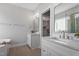 A gorgeous bathroom features a double vanity, framed mirrors, and a soaking tub at 934 Woodland Rd, Creedmoor, NC 27522