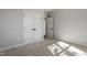 Bedroom boasts modern doors, neutral walls, and plush carpet flooring at 934 Woodland Rd, Creedmoor, NC 27522