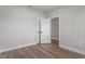 Minimalist bedroom featuring new floors and light-filled entry at 934 Woodland Rd, Creedmoor, NC 27522