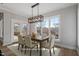 Elegant dining room with large windows providing natural light and a view of the outdoors at 934 Woodland Rd, Creedmoor, NC 27522
