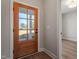 Welcoming foyer with wood-look flooring and a glass-paneled front door at 934 Woodland Rd, Creedmoor, NC 27522