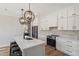 Stylish kitchen with a large island, pendant lights, and stainless steel appliances, perfect for entertaining at 934 Woodland Rd, Creedmoor, NC 27522