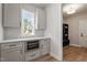 Charming kitchenette features ample storage, quartz counters and stainless appliances at 934 Woodland Rd, Creedmoor, NC 27522