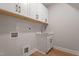 Functional laundry room with cabinets, sink, and connections for appliances at 934 Woodland Rd, Creedmoor, NC 27522