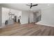 Spacious open-concept living area with wood floors and stylish staircase at 934 Woodland Rd, Creedmoor, NC 27522