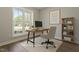 Bright home office with a large window, modern desk, and stylish decor creating a productive workspace at 934 Woodland Rd, Creedmoor, NC 27522