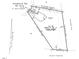 Overhead view of property, lot 48, featuring driveway, porch and nearby recreational area at 934 Woodland Rd, Creedmoor, NC 27522