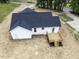 Aerial view of a white single-Gathering home with a dark roof and wood deck at 9600 Stallings Rd, Spring Hope, NC 27882