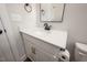 Modern bathroom with white vanity, black faucet, and quartz countertop at 9600 Stallings Rd, Spring Hope, NC 27882