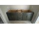 Bathroom vanity cabinet, showcasing its design and gold hardware at 9600 Stallings Rd, Spring Hope, NC 27882