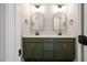 Elegant bathroom with dual vanity, modern mirrors and green cabinets at 9600 Stallings Rd, Spring Hope, NC 27882