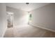 This carpeted bedroom has a window for natural light and a door leading to the closet at 9600 Stallings Rd, Spring Hope, NC 27882