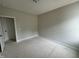 Unfinished bedroom features neutral paint, white trim, and an adjacent doorway at 9600 Stallings Rd, Spring Hope, NC 27882