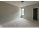 Bedroom with window providing natural light and white trim at 9600 Stallings Rd, Spring Hope, NC 27882