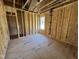 Spacious bedroom featuring a window for natural light, framed and ready for customization at 9600 Stallings Rd, Spring Hope, NC 27882