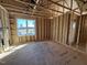 Bright bedroom framing with window and closet space, ready for personalization at 9600 Stallings Rd, Spring Hope, NC 27882