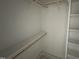 Walk-in closet has built-in shelves and rods for customizable storage solutions at 9600 Stallings Rd, Spring Hope, NC 27882