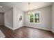 Inviting dining space featuring natural light, stylish chandelier, and wood-look flooring at 9600 Stallings Rd, Spring Hope, NC 27882
