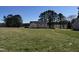 This exterior shot shows a newly constructed home on a spacious green lot with ample land at 9600 Stallings Rd, Spring Hope, NC 27882