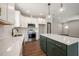 Contemporary kitchen featuring a center island, sleek countertops, and stainless steel appliances at 9600 Stallings Rd, Spring Hope, NC 27882