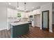 Modern kitchen with island, white cabinets, stainless steel appliances, and stylish pendant lighting at 9600 Stallings Rd, Spring Hope, NC 27882