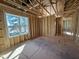 Open layout framing, naturally lit with windows and ready for your unique design at 9600 Stallings Rd, Spring Hope, NC 27882