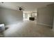 Open-concept living room flowing into kitchen, featuring ceiling fan and recessed lighting at 9600 Stallings Rd, Spring Hope, NC 27882