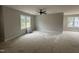 Bright and airy living room space featuring neutral paint colors and multiple windows for natural light at 9600 Stallings Rd, Spring Hope, NC 27882