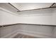 Empty walk-in closet with carpet and shelving at 9600 Stallings Rd, Spring Hope, NC 27882
