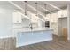 Modern kitchen features a large island, stainless steel appliances, and plenty of cabinet space at 98 Tee Time Ter, Benson, NC 27504