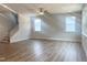 Bright living room with hardwood floors, natural light, and a staircase leading to the second floor at 98 Tee Time Ter, Benson, NC 27504