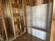 Unfinished bathroom with a new white tub/shower combo and exposed wall studs at 101 Parkland Dr, Pittsboro, NC 27312