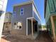 Modern home exterior featuring gray siding, white window trim, and a covered entryway at 101 Parkland Dr, Pittsboro, NC 27312
