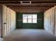 Unfinished room featuring window, ZIP System sheathing, and insulation, awaiting customization at 101 Parkland Dr, Pittsboro, NC 27312