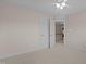 Neutral bedroom with white carpet, baseboards, trim and open door to the second floor landing at 1046 Upchurch Farm Ln, Cary, NC 27519