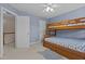 Bedroom featuring blue walls and wooden bunkbeds at 1046 Upchurch Farm Ln, Cary, NC 27519