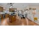 Eat-in kitchen features wood cabinetry and island with black granite countertop at 1046 Upchurch Farm Ln, Cary, NC 27519