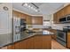 Kitchen offers stainless steel appliances and a granite island with counter seating at 1046 Upchurch Farm Ln, Cary, NC 27519